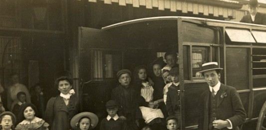 Children and teachers from Orwell Road Special School, Kirkdale get ready to set off for an enjoyable day trip wearing their best clothes, around 1910.