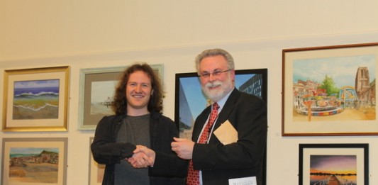 Felix Leyland (left) receives his award from Colin Simpson