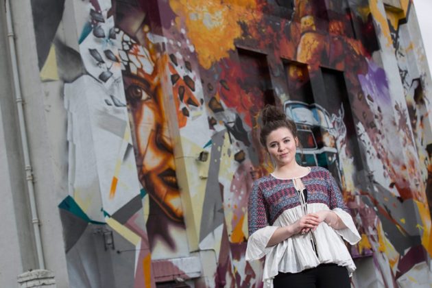 A giant piece of street art featuring Katherine Rose Morley, and the cult game WipeOut is painted outside the Littlewoods building in Liverpool by Local artists Replete and Beta. Photo c. Fabio DePaola/PA Wire